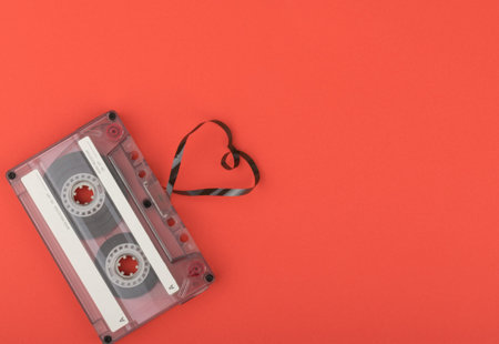 Audio cassette tape on red backgoundの写真素材