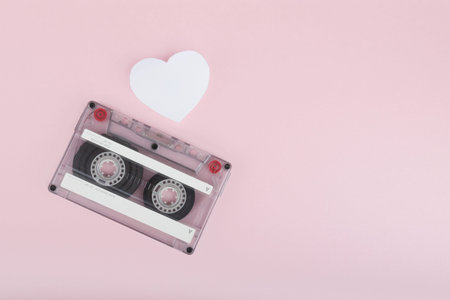 Audio cassette tape on pink backgound