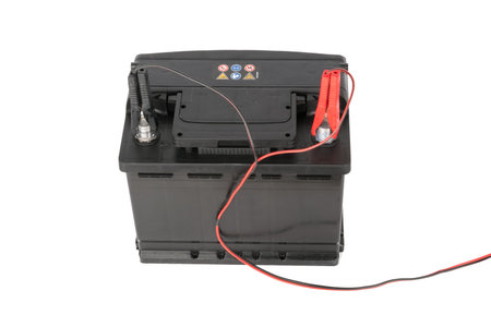 Car battery with two jumper isolated on white without shadow with clipping path
