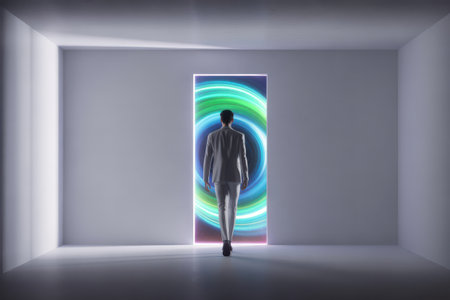 A man in a suit walks towards a brightly lit, swirling portal of green and blue light.の素材