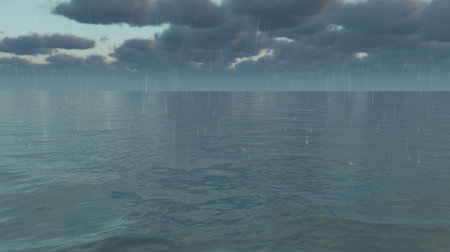 A vast expanse of blue ocean under a sky filled with dark grey stormy clouds and falling rain.の素材