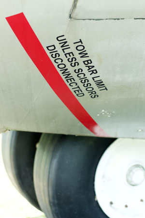 Tow bar limit unless scissors disconnected decal on an old aircraftのeditorial素材