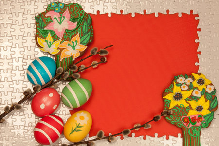 Painted Easter eggs and cakes on the frame with a red background