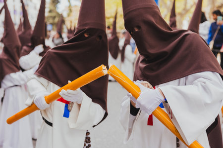 Holy Week procession with Nazarenes lighting a large candle, Holy Week concept.の写真素材