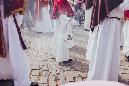 Holy Week procession with Nazarenes carrying smoldering incense, Holy Week concept.の写真素材