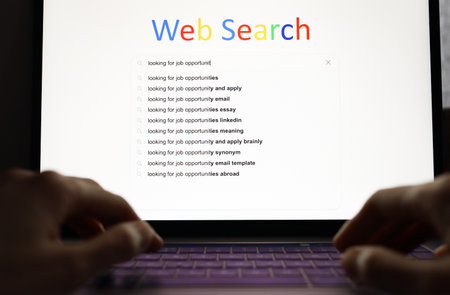 Job search concept, woman uses the Web Search to find open vacancies by laptop computerの写真素材