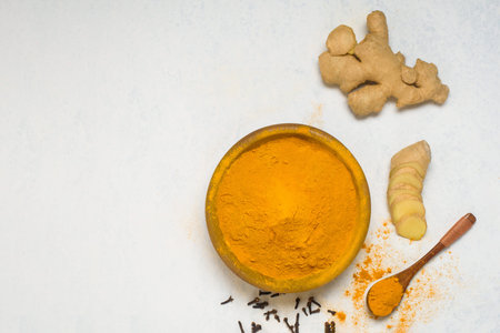 ingredients for Indian traditional Golden milk with turmeric, ginger, spices, honey. healing effect...