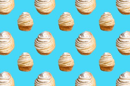 Seamless pattern of baking Cruffins on a blue background. muffins puff croissants trend 2020 . Wallpaper background pattern.の写真素材