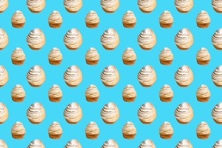 Seamless pattern of baking Cruffins on a blue background. muffins puff croissants trend 2020 . Wallpaper background pattern.の写真素材