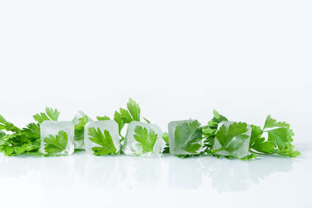 cosmetic ice cubes with parsley for home face and body care, self-care, Spa treatments, skin detox, natural organic cosmetics at homeの写真素材
