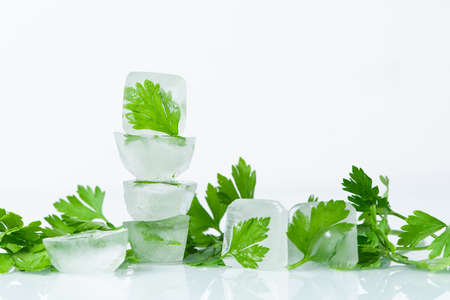 cosmetic ice cubes with parsley for home face and body care, self-care, Spa treatments, skin detox, natural organic cosmetics at homeの写真素材