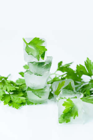 cosmetic ice cubes with parsley for home face and body care, self-care, Spa treatments, skin detox, natural organic cosmetics at homeの写真素材