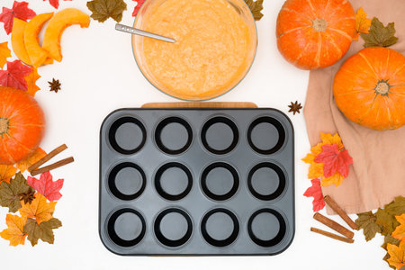recipe and ingredients for cooking autumn pumpkin cupcakes. top view on a light background. the...