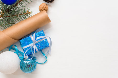 new year's background of Christmas tree branches, Christmas balls white and blue and dried orange on...