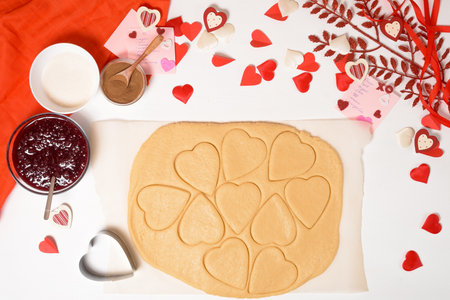 dough for heart cookies for Valentine's day, ingredients for baking for the holiday. decorative hearts top view.の写真素材