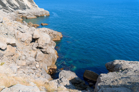panorama of the sea mountain coast, Crimea the Black Sea coast on a sunny day. rocks on the shore, blue sky.の写真素材