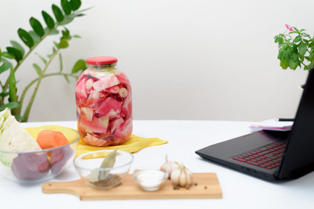 Cook at home online video recipes on a laptop Pickled pink cabbage fermentative with beets and...