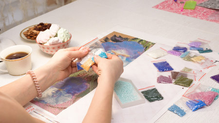 home hobby-to draw pictures of rhinestones, multi-colored diamond mosaic. the process of gluing...