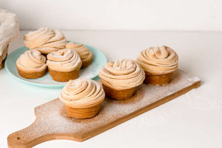 cruffins easter spring pastries, a mix of muffin and croissant on a light background, close-up for text place.の写真素材
