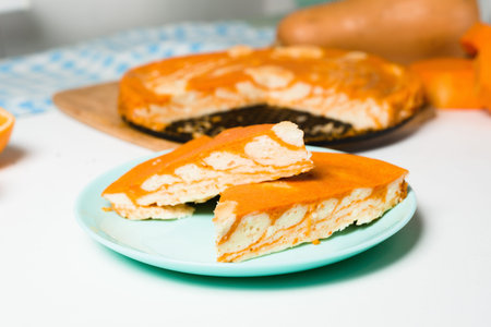 pumpkin casseroles with zebra-shaped cottage cheese, autumn orange pie. cut the pie into pieces on a...