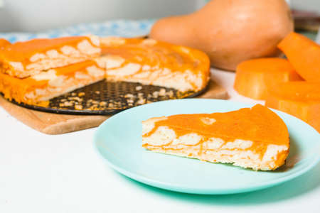 pumpkin casseroles with zebra-shaped cottage cheese, autumn orange pie. cut the pie into pieces on a plate .の写真素材