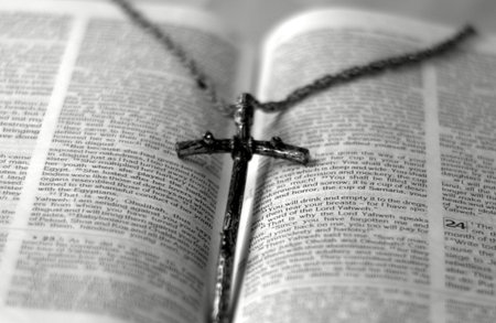 a bible with a cross on it in black and whiteの写真素材