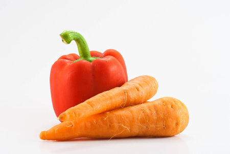 Bell pepper and carrot isolated on whiteの写真素材