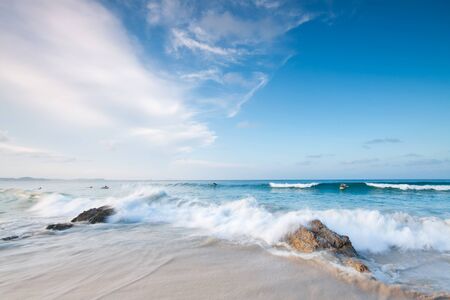 australian beach during the day with big cloud formation in backgroundの写真素材