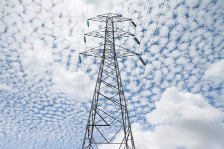 electric power tower with interesting cloud formation in background