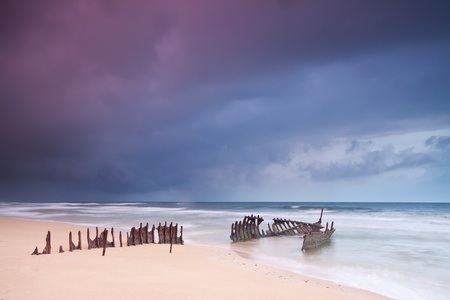 wreck on australian beach at dawn (ss dicky wreck,dicky beach, queensland)の写真素材