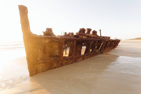 Sunrise on remote Australian beach in Great Sandy National Park - Fraser Island, Maheno Wreck, QLD, Australiaの写真素材