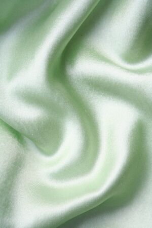 Smooth elegant green silk can use as backgroundの写真素材