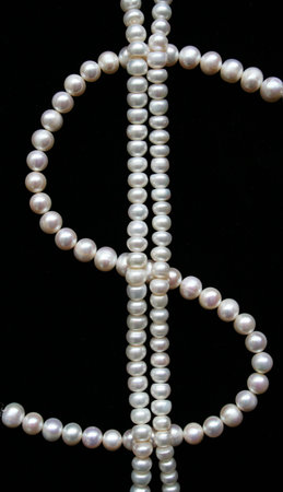 White pearls on the black velvet can use as backgroundの写真素材