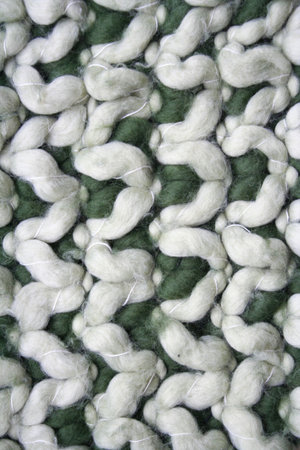 Green and white knitted wool background