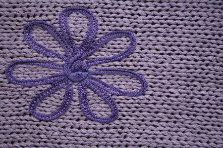 Lilac knitted fabric with flower can use as background