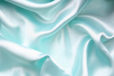 Smooth elegant blue silk can use as backgroundの写真素材