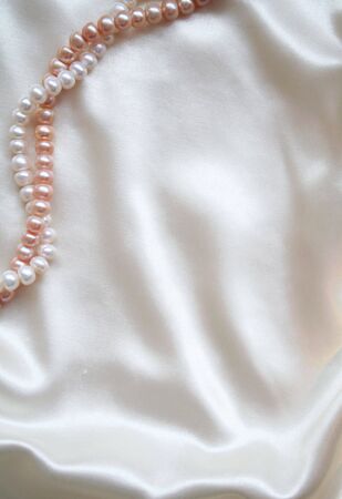 Smooth elegant white silk with pearls can use as wedding background の写真素材