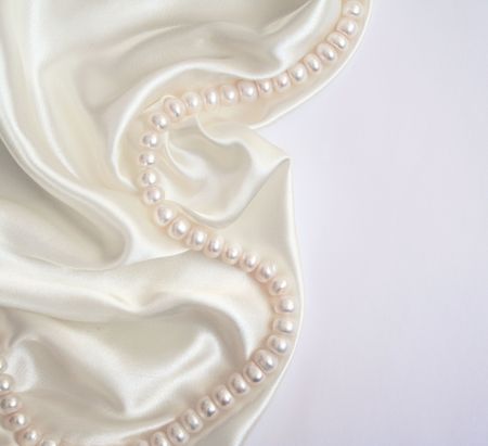 Smooth elegant white silk with pearls can use as wedding background の写真素材