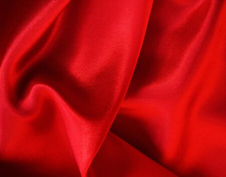 Smooth elegant red silk can use as background の写真素材
