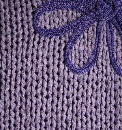 Lilac knitted fabric with flower can use as background