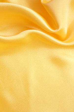 Smooth elegant golden silk can use as background の写真素材