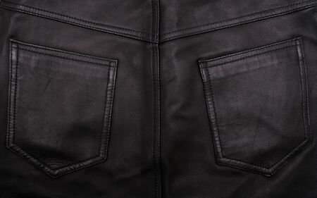 Pockets on the black leather texture can use as background の写真素材