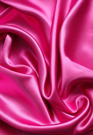 Smooth elegant pink silk can use as backgroundの写真素材