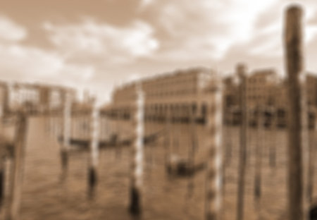 VENICE, ITALY. Beautiful view of famous Grand canal with venetian gondolas. In Sepia toned. Retro style. In blur styleの写真素材