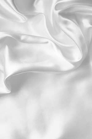 Smooth elegant white silk or satin texture can use as wedding backgroundの写真素材