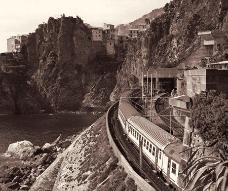 Train at station Manarola in Cinque Terre, Italy, Sepia toned, Retro style
