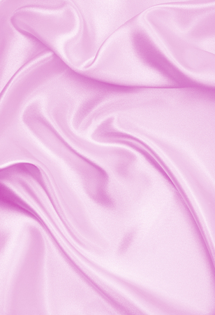 Smooth elegant pink silk or satin texture can use as wedding background. Luxurious valentine day background designの写真素材