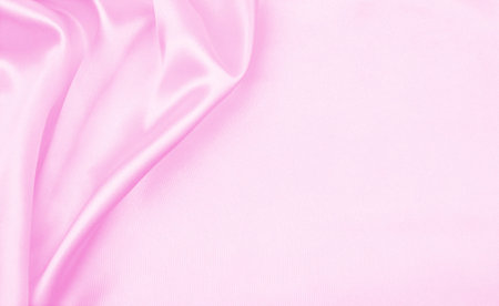 Smooth elegant pink silk or satin texture can use as wedding background. Luxurious background designの写真素材