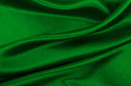 Smooth elegant green silk or satin luxury cloth texture can use as abstract background. Luxurious background designの写真素材