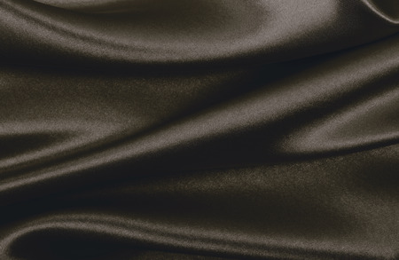 Smooth elegant brown silk or satin texture can use as abstract background. Luxurious background design. In Sepia toned. Retro styleの写真素材